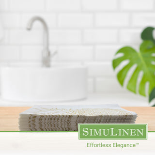 Image of gold pineapple guest towels on a bathroom sink.