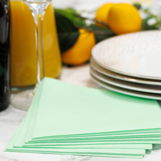 Pistachio beverage napkins with mimosa setting
