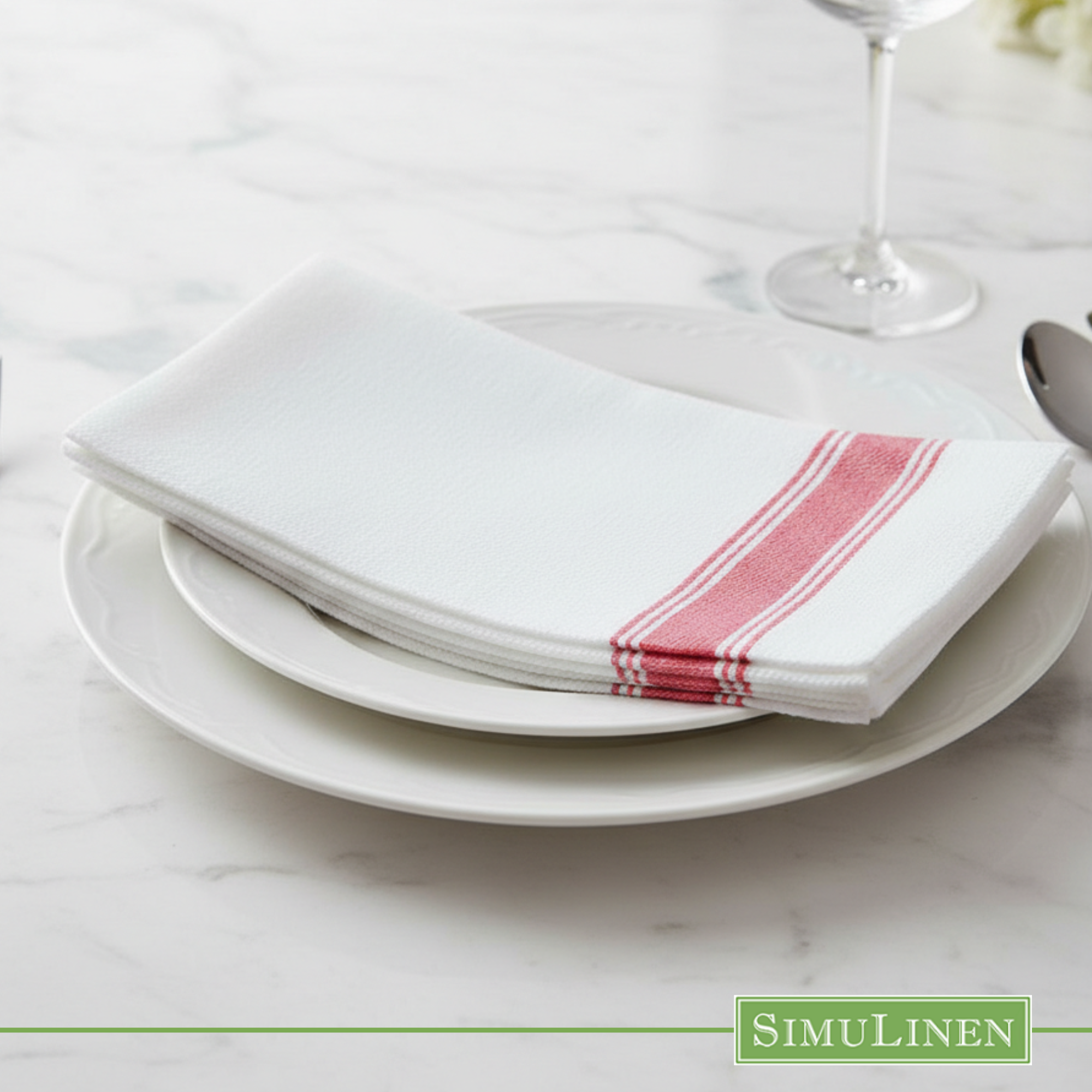 Red bistro stripe SimuLinen dinner napkin on white plate kitchen counter
