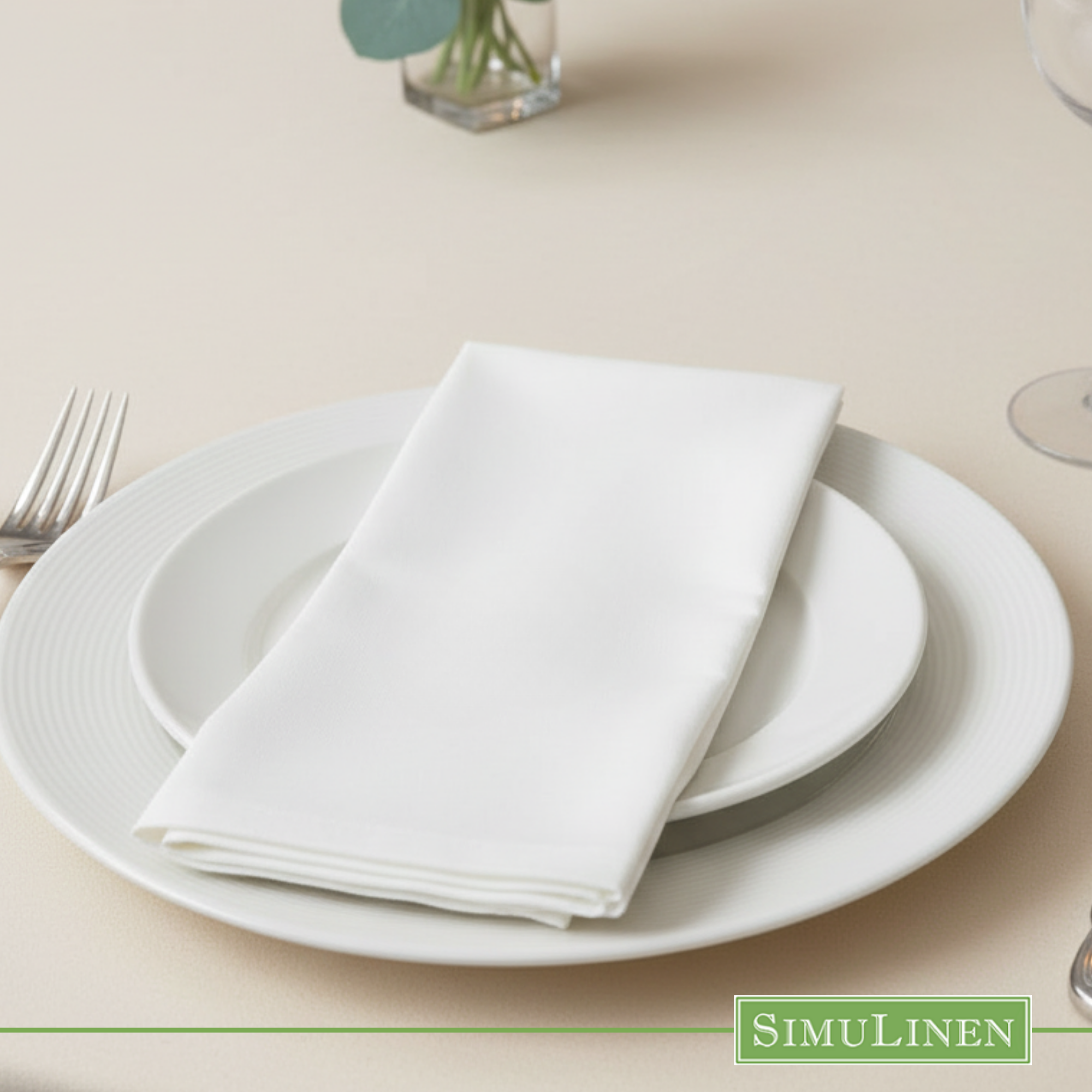 White SimuLinen napkin on white plate