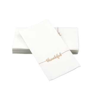 SimuLinen Thankful guest towels. These are a white disposable guest towel with the word "Thankful" written across the napkin in gold lettering.