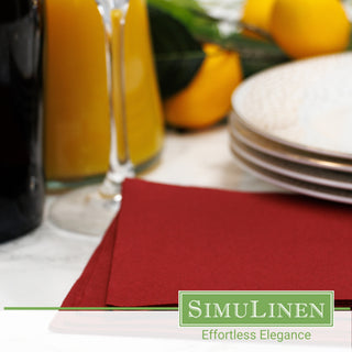Burgundy cocktail napkins in a dinner setting.