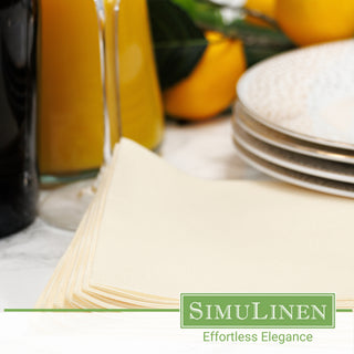 Champagne disposable beverage napkins in a dinner setting.
