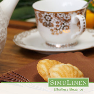 SimuLinen copper cocktail napkins with a fancy tea cup in the background.