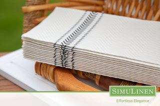 A close-up of SimuLinen black bistro ClassicPoint napkins in a picnic setting.