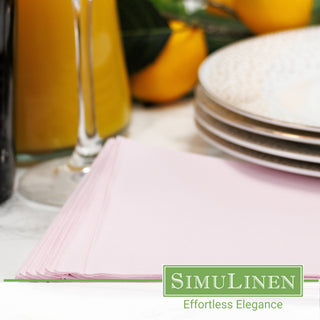 Light pink cocktail napkins in a dinner setting.