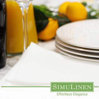 White beverage napkins in a dinner setting.