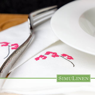 SimuLinen ClassicPoint Orchid dinner napkins in a dinner setting.