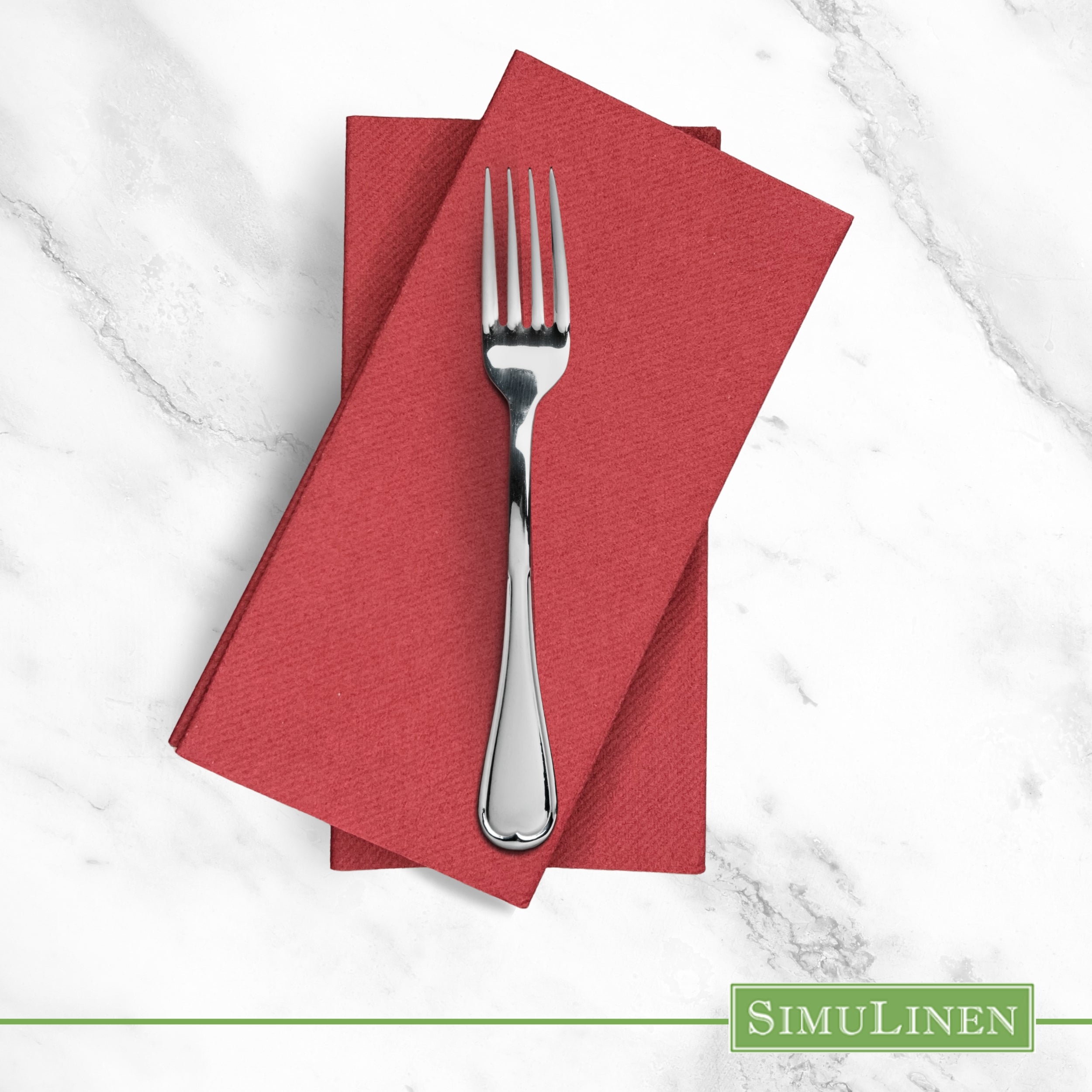 Burgundy red SimuLinen dinner napkin on marble counter with fork