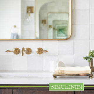 Image of SimuLinen gold floral guest towels on a bathroom sink.