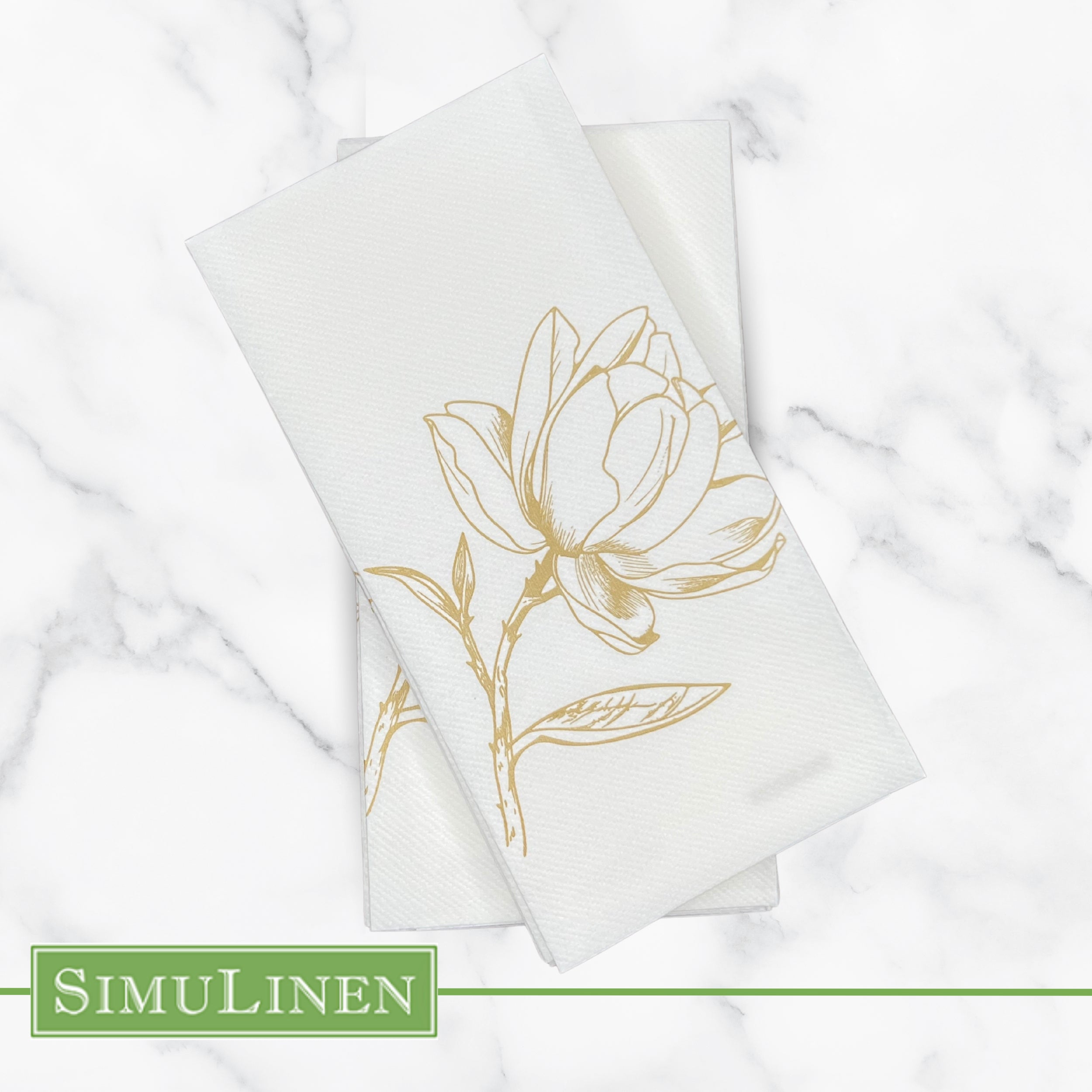 Gold magnolia SimuLinen guest hand towel on marble counter top