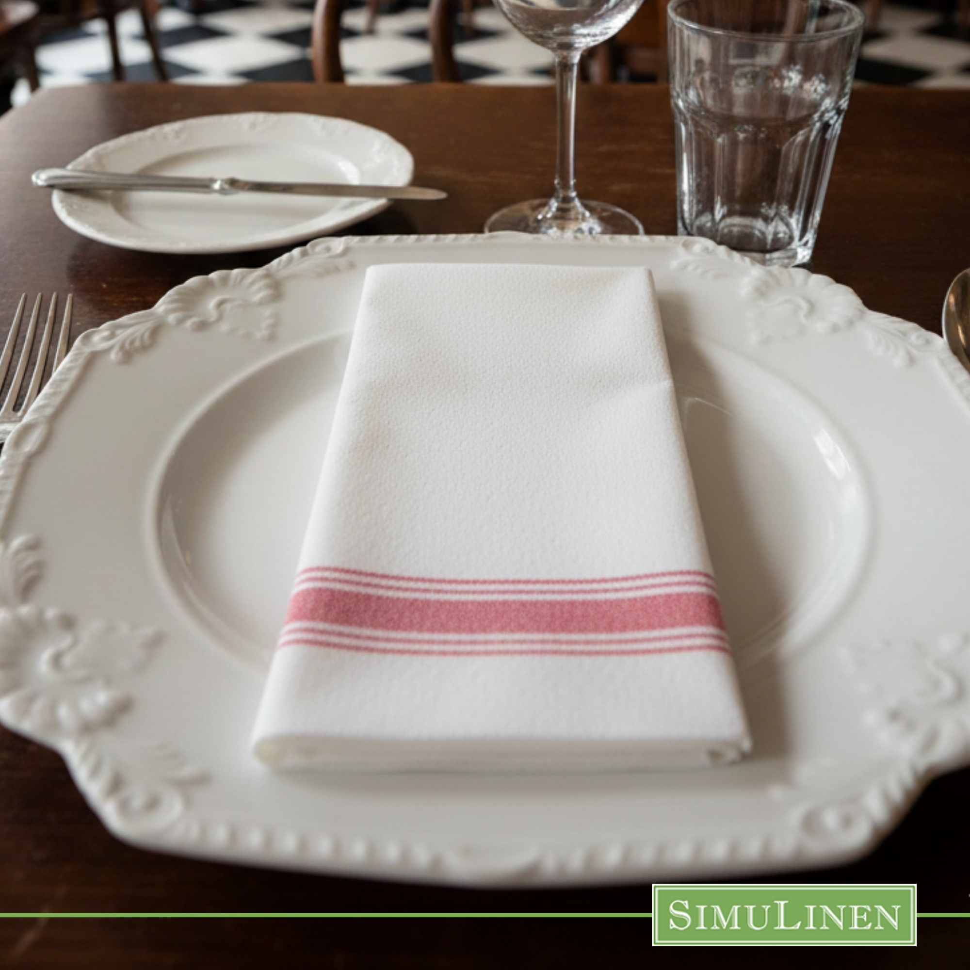 Red bistro stripe SimuLinen dinner napkin on fancy white plate 