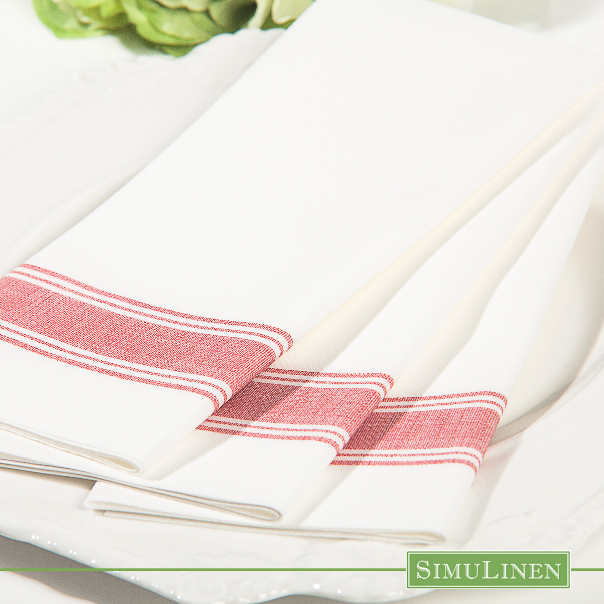 Red bistro stripe SimuLinen dinner napkins close up on white plate