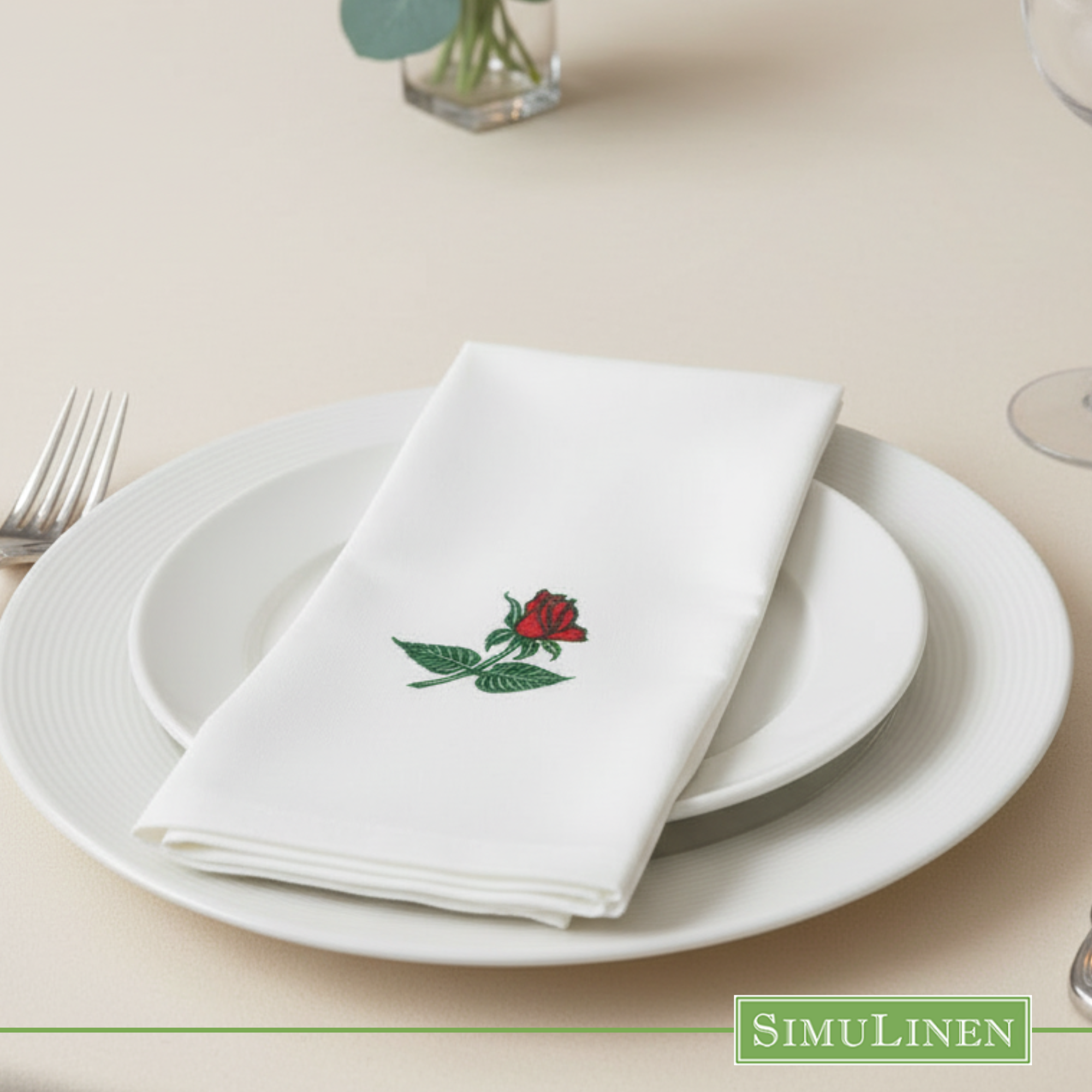 Rose SimuLinen dinner napkin on white plate