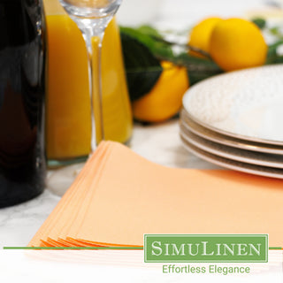 A close-up of SimuLinen apricot beverage napkins in a dinner setting.