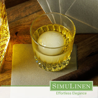 SimuLinen Beige Grey beverage napkins underneath a whiskey glass.