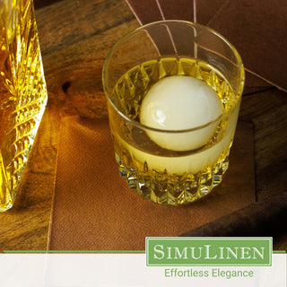 SimuLinen copper beverage napkin underneath a whiskey glass.