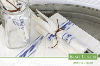Silverware elegantly wrapped in Blue Bistro ClassicPoint Napkins.