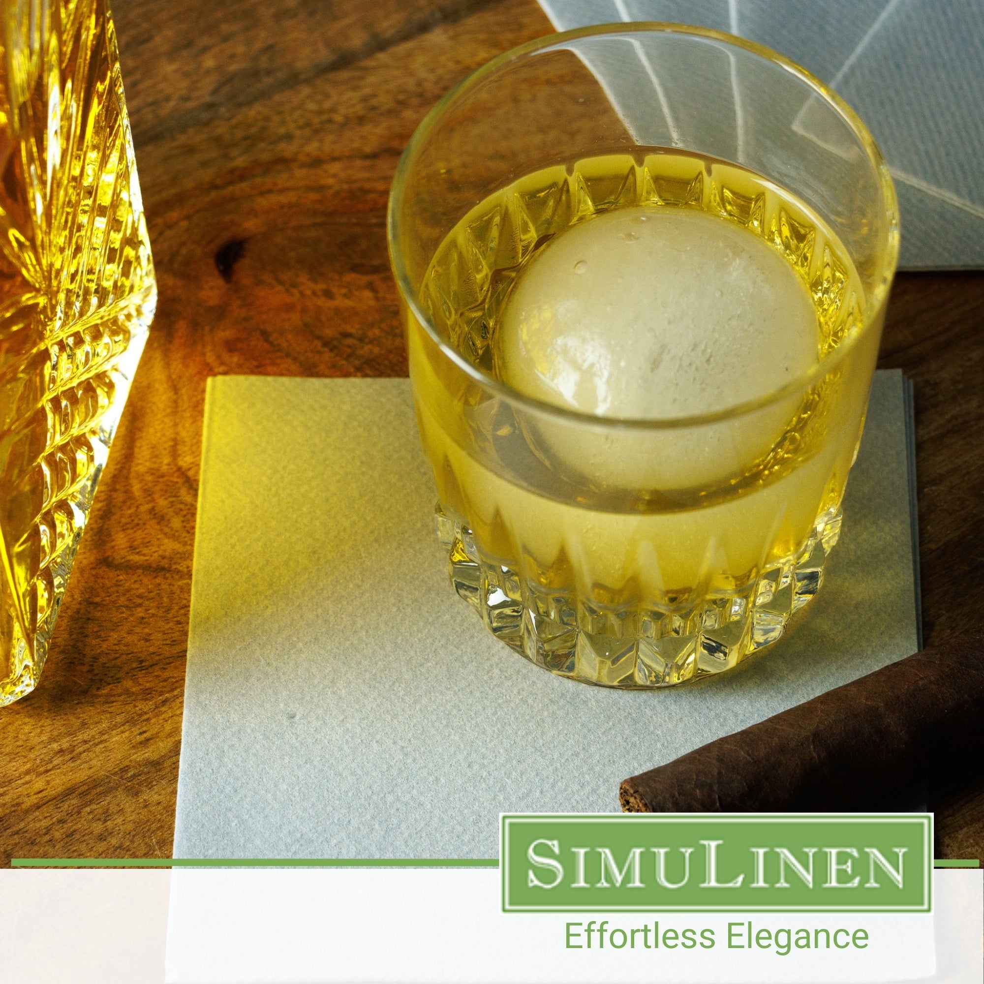 SimuLinen rich grey cocktail napkins with a glass of whiskey.