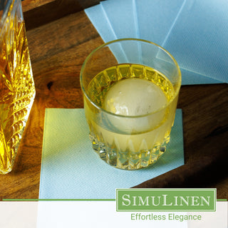 SimuLinen light blue napkins with a glass of whiskey.