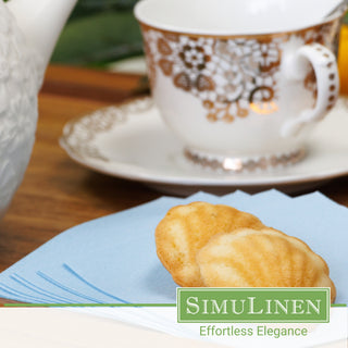 SimuLinen light blue beverage napkins with a fancy tea cup.