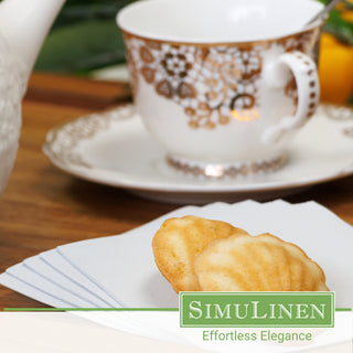 SimuLinen light grey beverage napkins with a fancy tea cup in the background.