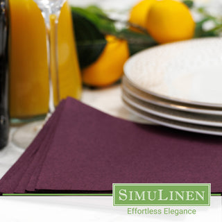 Plum cocktail napkins in a dinner setting.