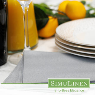 Silver beverage napkins in a dinner setting.