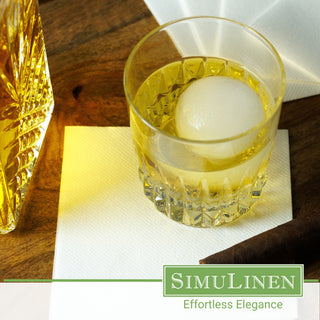 SimuLinen white beverage napkins with a glass of whiskey.