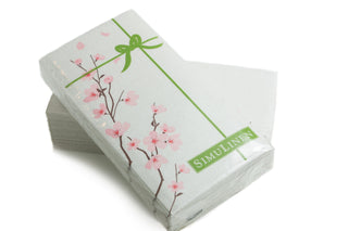 Image of Cherry Blossoms guest towels in their shrink-wrapped packaging.